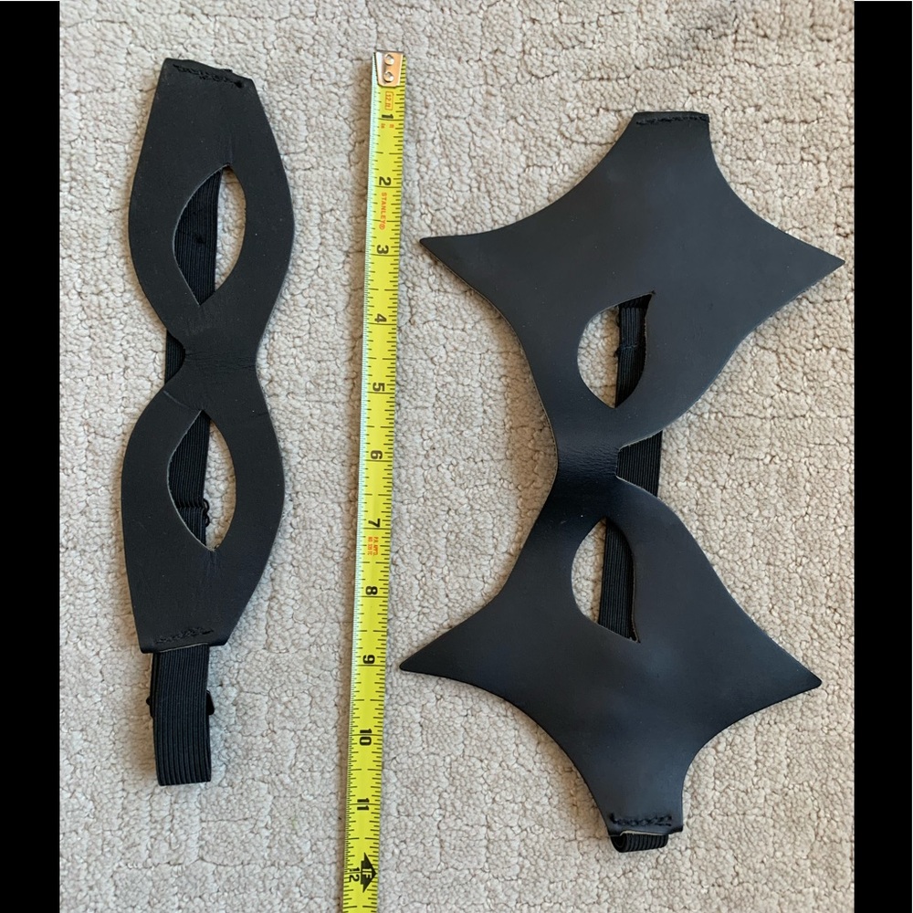 Pair of black leather masks